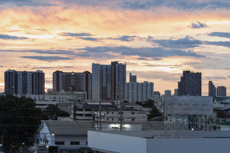 Bangkok, Thailand - 14 Aug 2024 - Beautiful Clouds in the Sky over Large Metropolitan City of Bangkok. View of Skyscrapers and Dramatic Sky before Sunset, Copy space, Selective focus.のeditorial素材