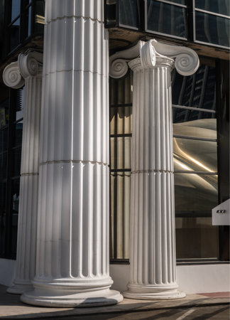 Bangkok, Thailand 23 Dec, 2024 - The morning light shining through Classic pillars detail of Modern...