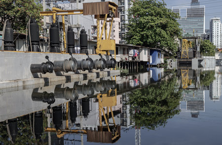 Bangkok, Thailand - Feb 19, 2025 - A pumping station along a canal in Sukhumvit soi 4. The station pumps that uses pumps to move water or wastewater from one place to another. They are also known as pumphouse.の写真素材