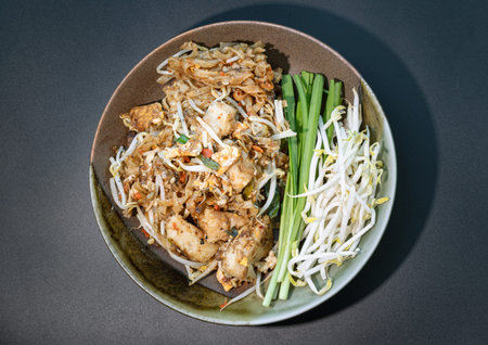 Traditional fried thai noodle (pad thai) mix Stirred fried turnip cake or Fried radish cake (chai...