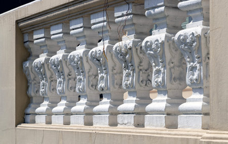 Bangkok, Thailand - Mar 02, 2025 - The Sunlight shining through Row of Vintage concrete railings....