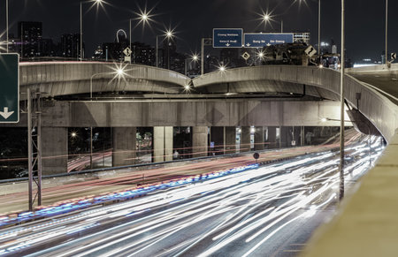 Bangkok, Thailand - Jan 10, 2025 - A nightscape view with bright glowing light trails effect of many...
