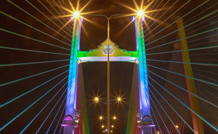 Bangkok, Thailand 10 Jan, 2025 - Stunning scenery of Thotsamarachan Bridge or King Rama X Bridge crossing Chao phraya river with evening sky in the background. use it as your Wallpaper, Poster and Space for text, Selective focus.の写真素材