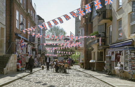 Windsor, England - Apr 3, 2025 - People and tourists are relaxing on street in the afternoon at Windsor, Berkshire. use it as your Wallpaper, Poster and Space for text, Selective focus.の写真素材