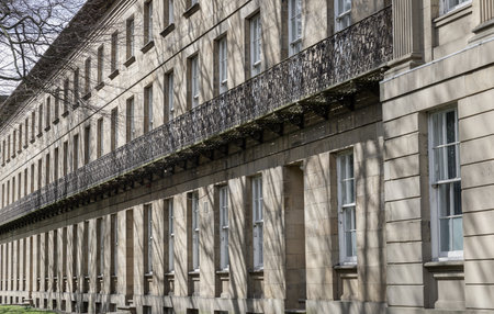 Newcastle, UK - Apr 13, 2025 - Perspective view of Leazes Terrace is an elongated square of houses with Wrought iron black railings balconies and Glass windows in Newcasle.の写真素材