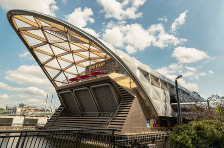 London, UK - Jun 18, 2025 - the distinctive Lattice Roof structure of Crossrail Place at Canary Wharf tube station, This structure is notable for featuring one of the longest contiguous wooden roofs in the United Kingdom, The building has been described as an "enormous, ship-like building". use it as your Wallpaper, Poster and Space for text, Selective focus.の写真素材