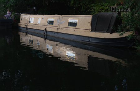 London, UK - Jun 21, 2025 - a picturesque area of Little Venice in West London, It is the junction point of the Grand Union Canal and the Regent's Canal, its tranquil canals and waterways lined with narrowboats and houseboats. use it as your Wallpaper, Poster and Space for text, Selective focus.の写真素材
