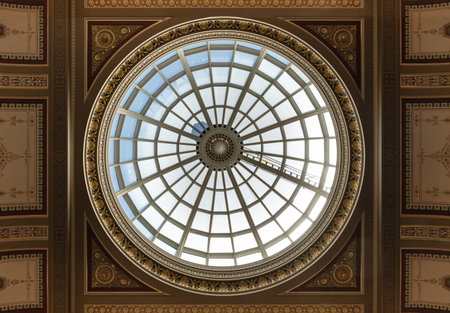 London, UK - Jul 21, 2025 - the architectural design of the large glass domed ceiling or skylight...