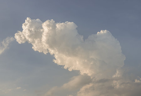 The sky is being covered with fluffy white clouds. Amazing clouds like a heaven for background...