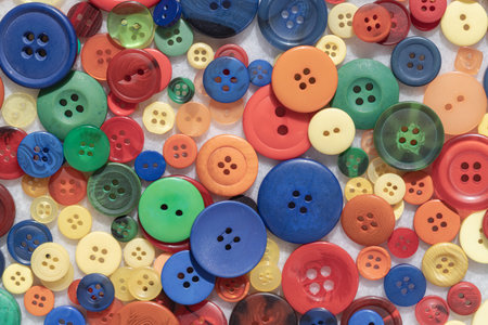 Top view of A diverse collection of colorful sewing buttons. Various shapes, sizes and patterns....