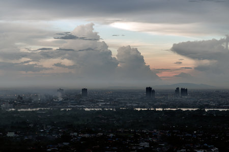 Bangkok, Thailand - 13 Oct, 2024 - Aerial view of Bangkok city and beautiful clouds in sky background with the Chao Phraya River before sunset. use it as your wallpaper, poster and Space for text, Selective focus.の写真素材
