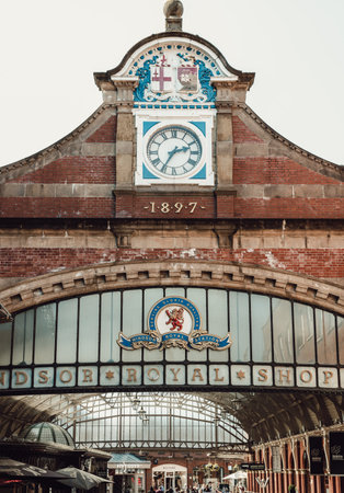 Windsor, UK - Apr 3, 2025 - The entrance arch of Windsor Royal Shopping complex is situated in the Windsor and Eton Central Station opposite Windsor Castle. use it as your Wallpaper, Poster and Copy space, Selective focus.の写真素材