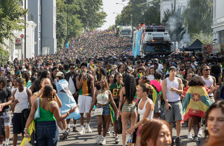 London, UK - Aug 25, 2025 - a large gathering of people at the Notting Hill Carnival in West London,...