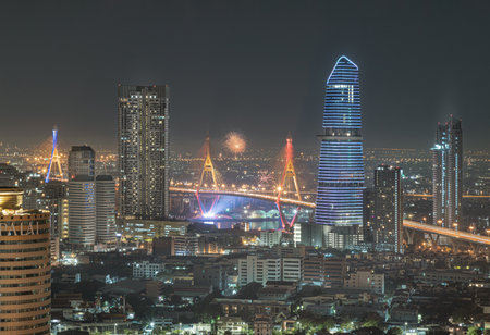 Bangkok, Thailand 31 Dec, 2024 - New Year's Eve fireworks burst over Bangkok's Bhumibol Bridge, creating a beautiful city view.のeditorial素材