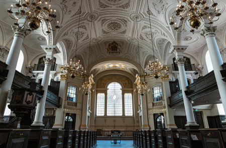 London, UK - Jul 12, 2025 - Architecture interior with arched ceilings, Corinthian columns and glass is subtly distorted within a lattice of curvilinear glazing bars is the east window. which blend elements of Baroque ornamentation and Palladian designs oのeditorial素材