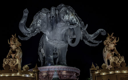 Samut Prakan, Thailand - 13 December 2019 : Erawan Museum is a Elephant head sculpture with 3 heads on dark night background, It is one of the important and unique tourist.のeditorial素材