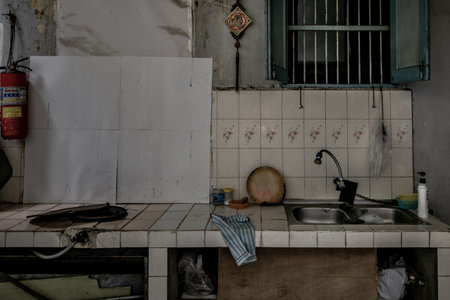Bangkok, Thailand - Dec 7, 2019 : Ancient tiled countertops with gas stove and kitchen sink In front of the old house.のeditorial素材