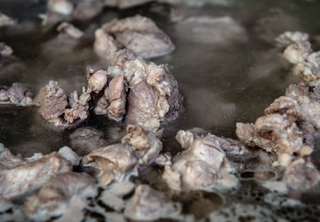 Closeup of boiling pork rib soup in hot pot of boiling water, Soup of pork ribs, Selective focus.の写真素材