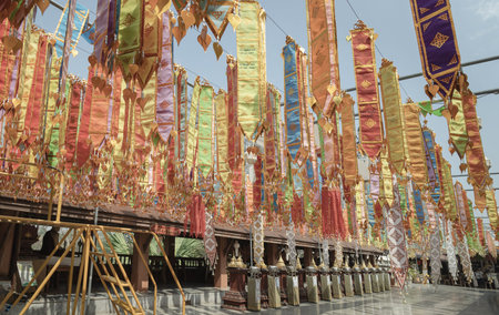 Phrae, Thailand - Feb 17, 2026 - An intricate canopy of Tung traditional Lanna ceremonial banners...