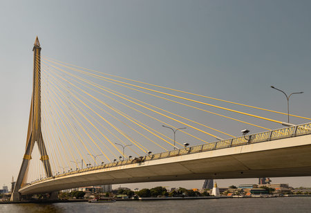 Bangkok, Thailand - Mar 02, 2025 - The Rama VIII Bridge is a striking asymmetrical cable-stayed...