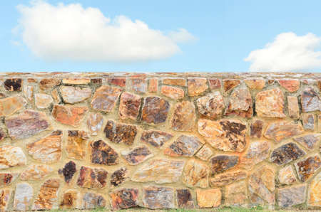 Stone wall background and blue skyの写真素材