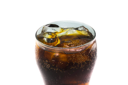 Closeup soft drink in glass on white background.