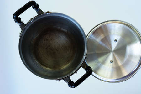 Used metal stock pot isolated on white. Cookwareの写真素材