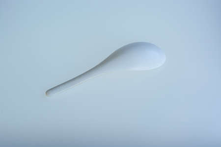 used Rice scoop white plastic on isolate white backgroundの写真素材