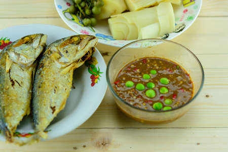 Shrimp paste and curry with fried mackerel and vegetableの写真素材
