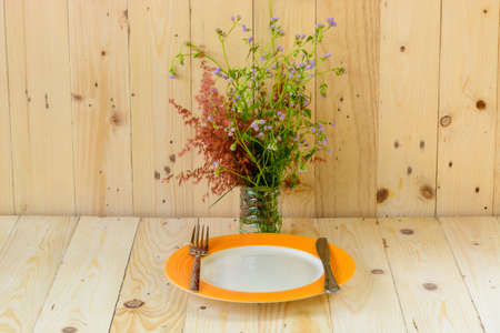 beautiful purple flower on the desk over white wooden background with copy space for design, romantic vintage backgroundの写真素材