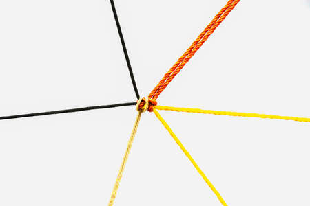 Connected group concept as many different ropes tied and linked together as an unbreakable chain as a community trust and faith metaphorの写真素材