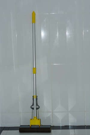 Mop put on the bathroom wallの写真素材