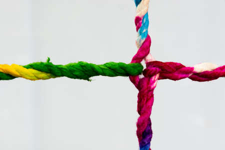 Connected group concept as many different ropes tied and linked together as an unbreakable chain as a community trust and faith metaphor and learningの写真素材