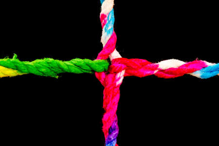 Connected group concept as many different ropes tied and linked together as an unbreakable chain as a community trust and faith metaphor and learningの写真素材