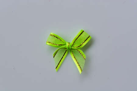 green ribbon bow on white backgroundの写真素材