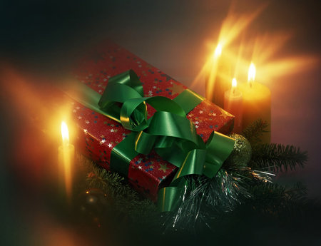 christmas still life with a gift and candlesの写真素材