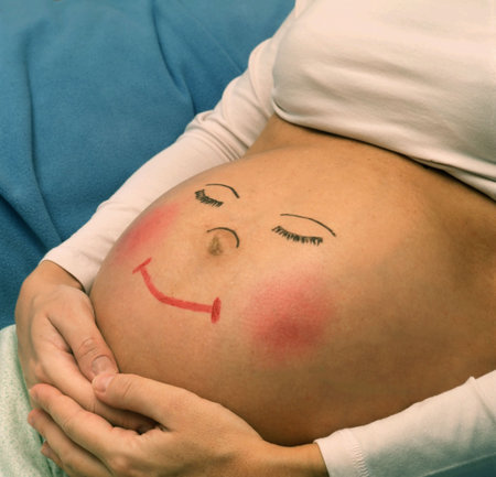 Pregnant belly with picture of funny face