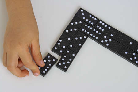 hand playing the dominoの写真素材