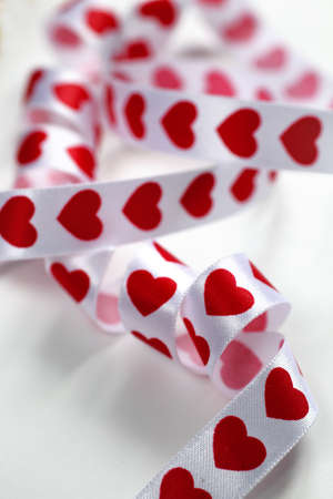 white hearts ribbon curled in whiteの写真素材
