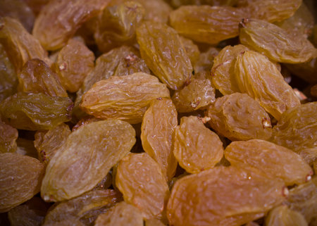 Macro shot of Indian yellow raisin dry fruits.