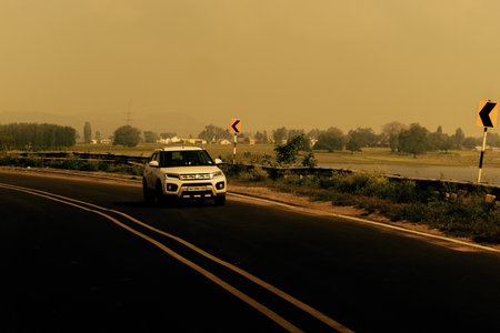 "Bangalore,India- 6th December 2021: Brand new Maruti Suzuki vitara brezza car moving on highway,landscape shot with road signs"のeditorial素材