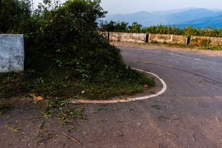 Dangerous hilltop road curve,winding road curve.の写真素材
