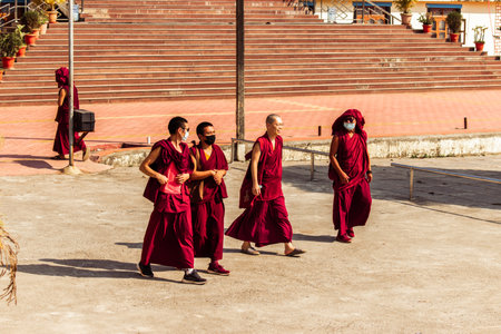 "Mundgod, Karnataka,India- 6th February 2022: Tibetan monks wearing masks,walking on the street"のeditorial素材