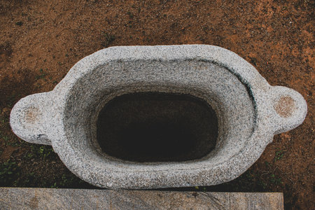 Water storage basin made of Stone,top view with partially filled water.