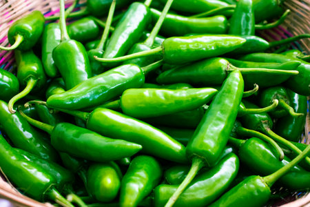 Fresh green Anaheim chile pepper background.の写真素材