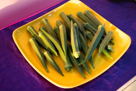 Fresh young okra on a plate,closeup shot.の写真素材