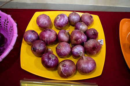 Fresh red onions on a plate.の写真素材