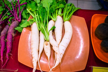Group of fresh multi-colored radish, closeup shot.