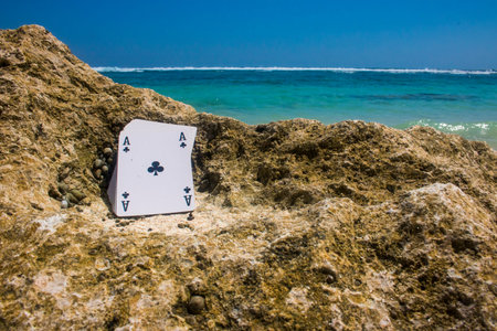 ace of club poker card beach theme photoの写真素材
