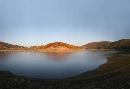 Reservoir Edersee in Germany during sunset with extreme low water level in October 2008の写真素材